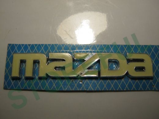 Эмблемма пластик в блистере надпись MAZDA белая 11x2 см