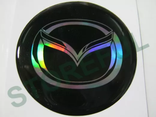 наклейка (объемная) "На колпаки "Mazda" наружная голограф., (цвет черный), (комплект 4 шт), диам.6см